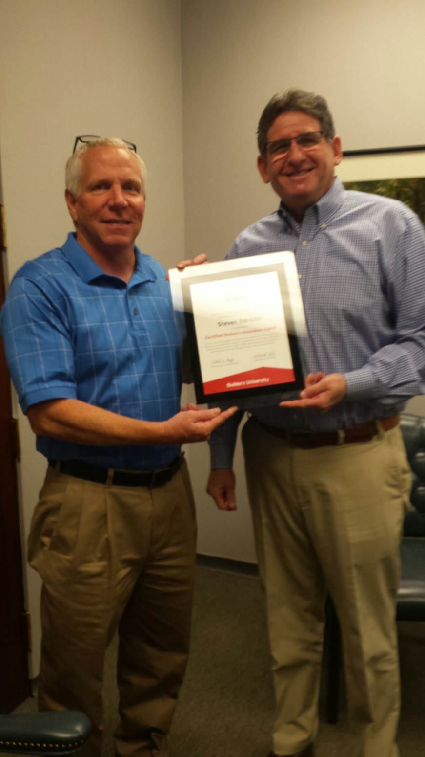 John Parrish presents CBIA designation to Steven Odrezin